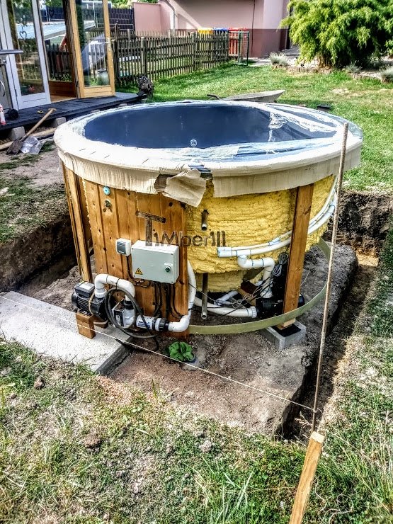 Sunken built in fiberglass hot tub with the electric heater